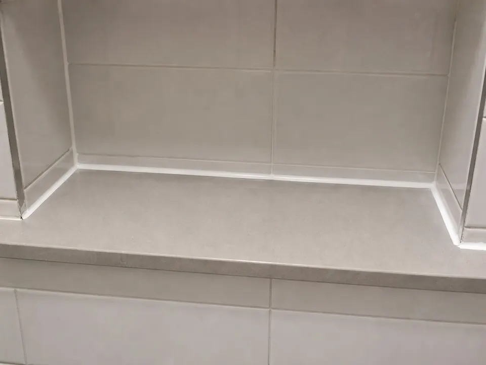 Shower ledge re-sealed after