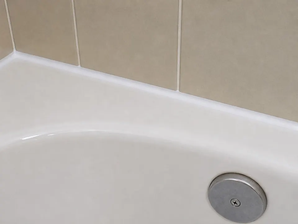 Old tub caulk removed after