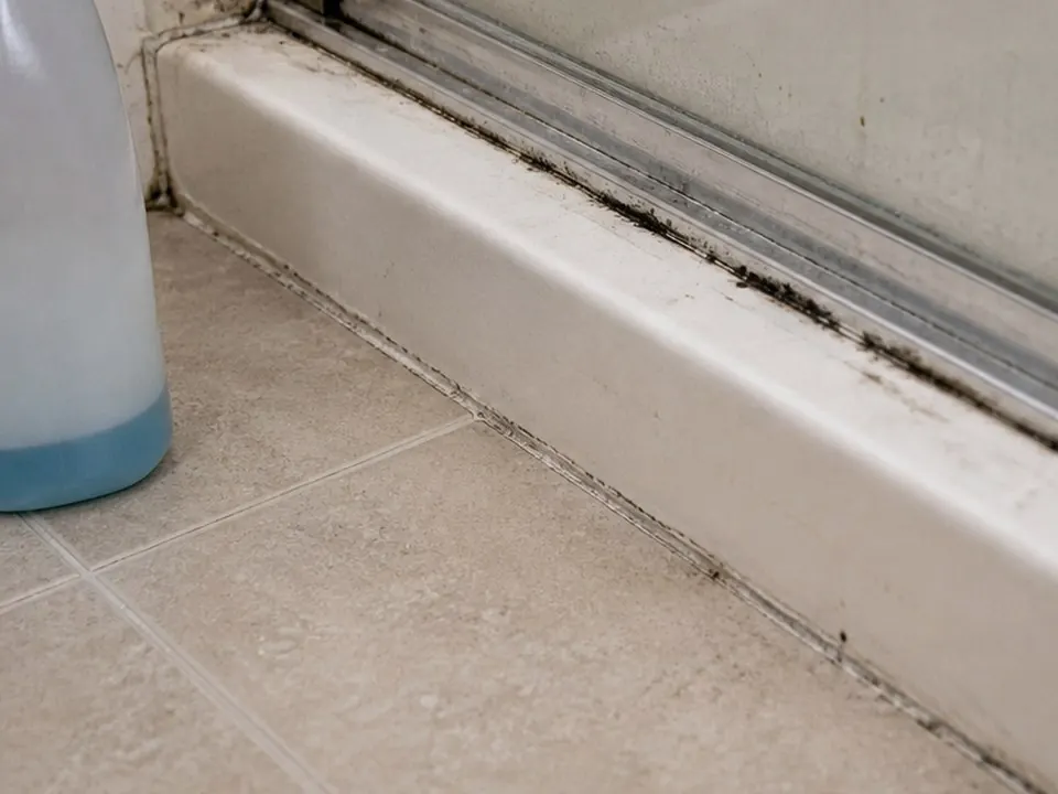 Glass door track cleaned before