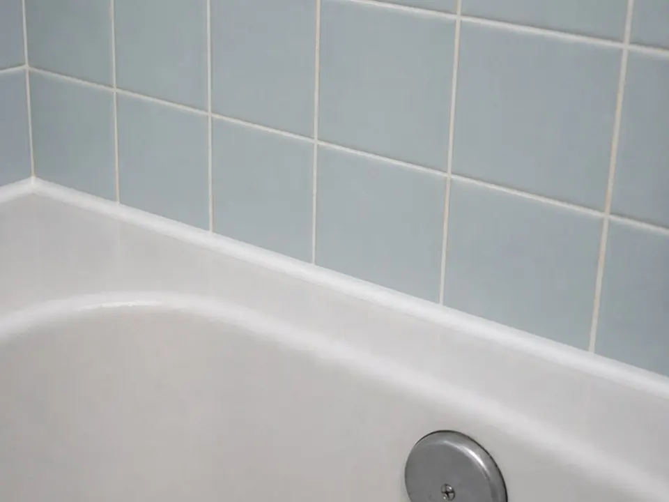 Blue tile tub joint after