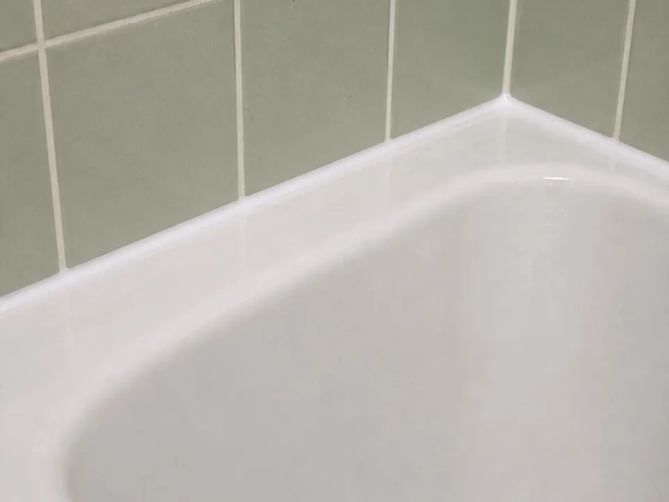 Green tile tub edge after